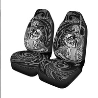 Pair of black front seat covers with Polynesian warrior artwork and 'YOUR TEXT' headrests