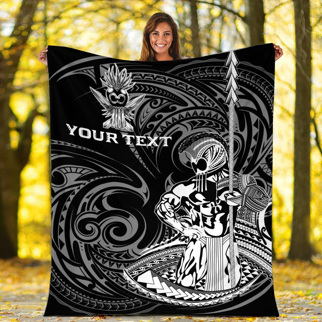 Black Hawaii warrior blanket with white tribal artwork and “YOUR TEXT” held outdoors