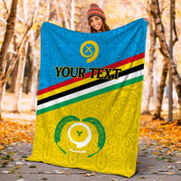 Flag-style Vanuatu Torba Province blanket outdoors, blue top and yellow bottom with emblem