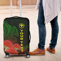 Black luggage cover with green leaf pattern, red flowers, and yellow “YOUR TEXT”