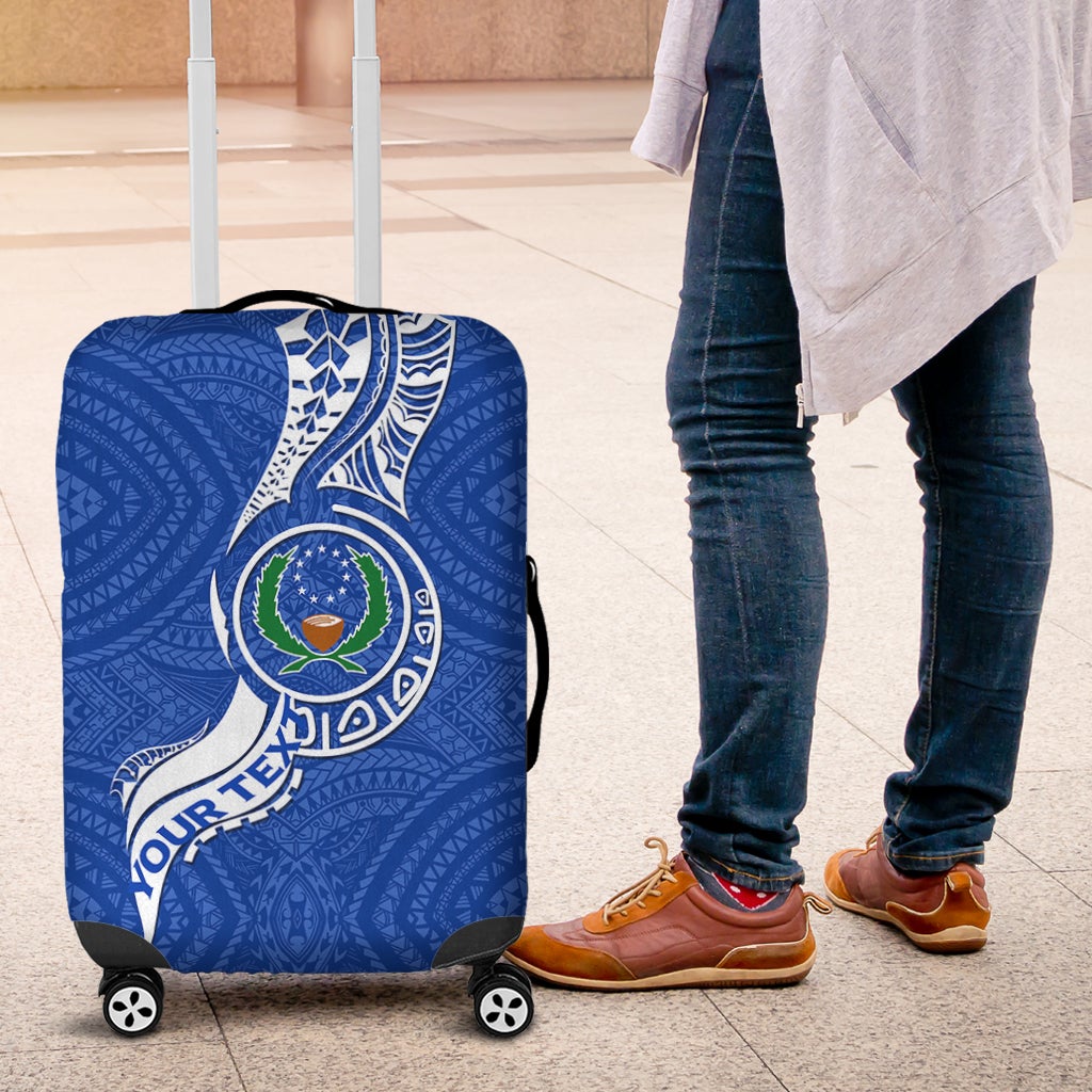 Blue Pohnpei luggage cover featuring emblem artwork over suitcase wheels
