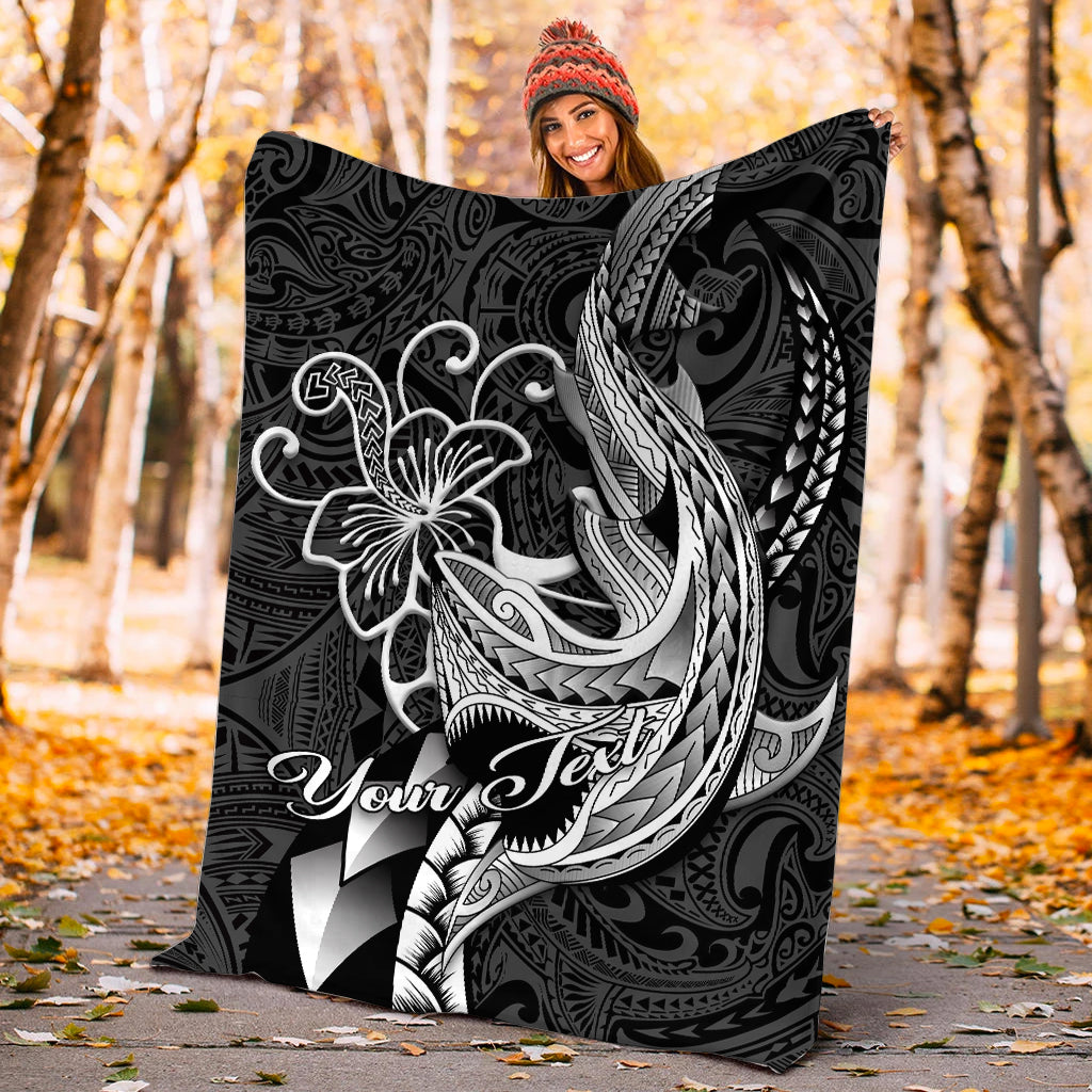 Black Polynesian shark tattoo blanket held outdoors with white tribal shark artwork