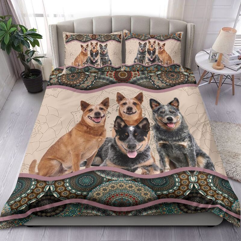 Dog bedding set with three Australian Cattle Dogs on cream quilt, teal paisley trim and pillows