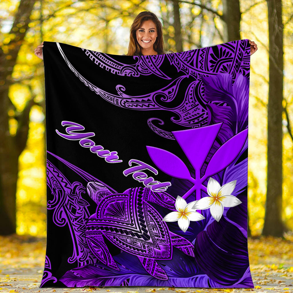 Black and purple Hawaii turtle blanket with plumeria blooms and Aloha script, held up