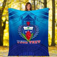 Blue blanket held up outdoors, crest logo and 'YOUR TEXT' printed near center