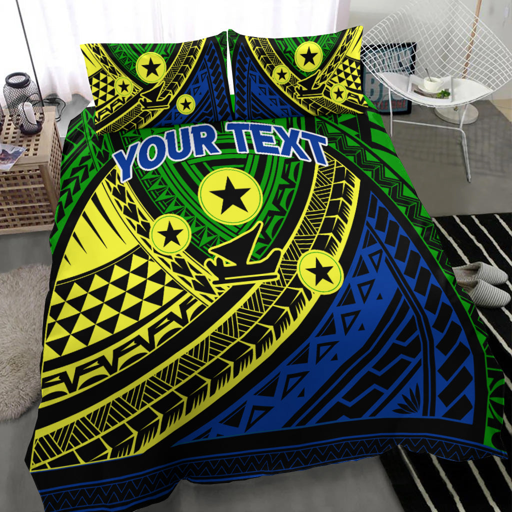 Green tribal bedding set with blue diagonal panels, yellow accents, stars, and 'YOUR TEXT'
