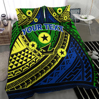 Green tribal bedding set with blue diagonal panels, yellow accents, stars, and 'YOUR TEXT'