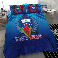 Blue bedding set with two pillows and duvet, bold 'YOUR TEXT' over crest emblem