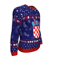 Blue sweatshirt side view with Croatia crest panel, red cuffs, snowflake pattern