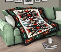 Native American-style quilt on couch with black border and multicolor geometric center design