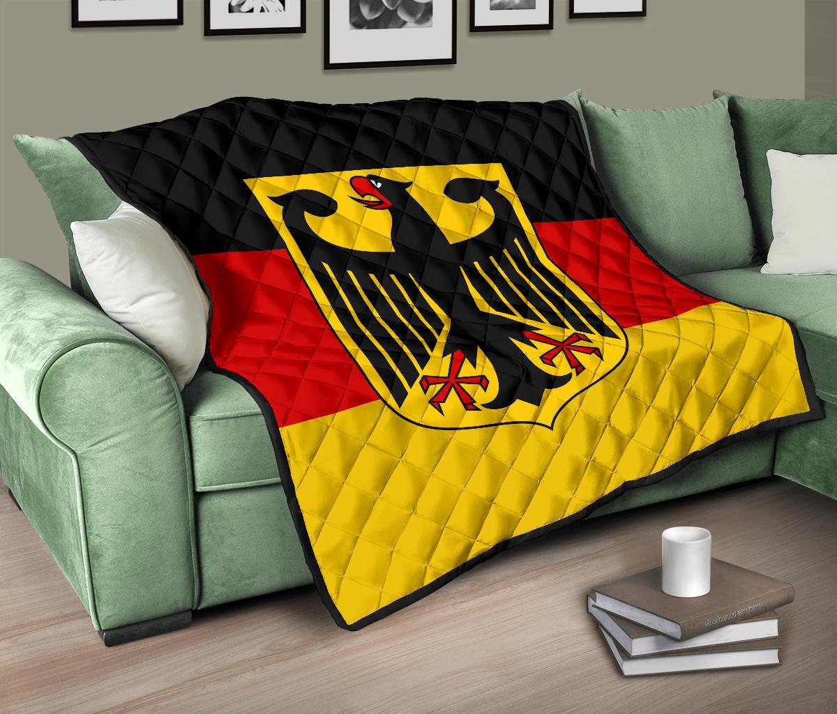 Germany flag quilt on green sofa, black top and red/yellow stripes with eagle shield