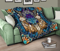 Blue wolf mandala quilt on green sofa, purple feather centerpiece with turquoise circular corner accents