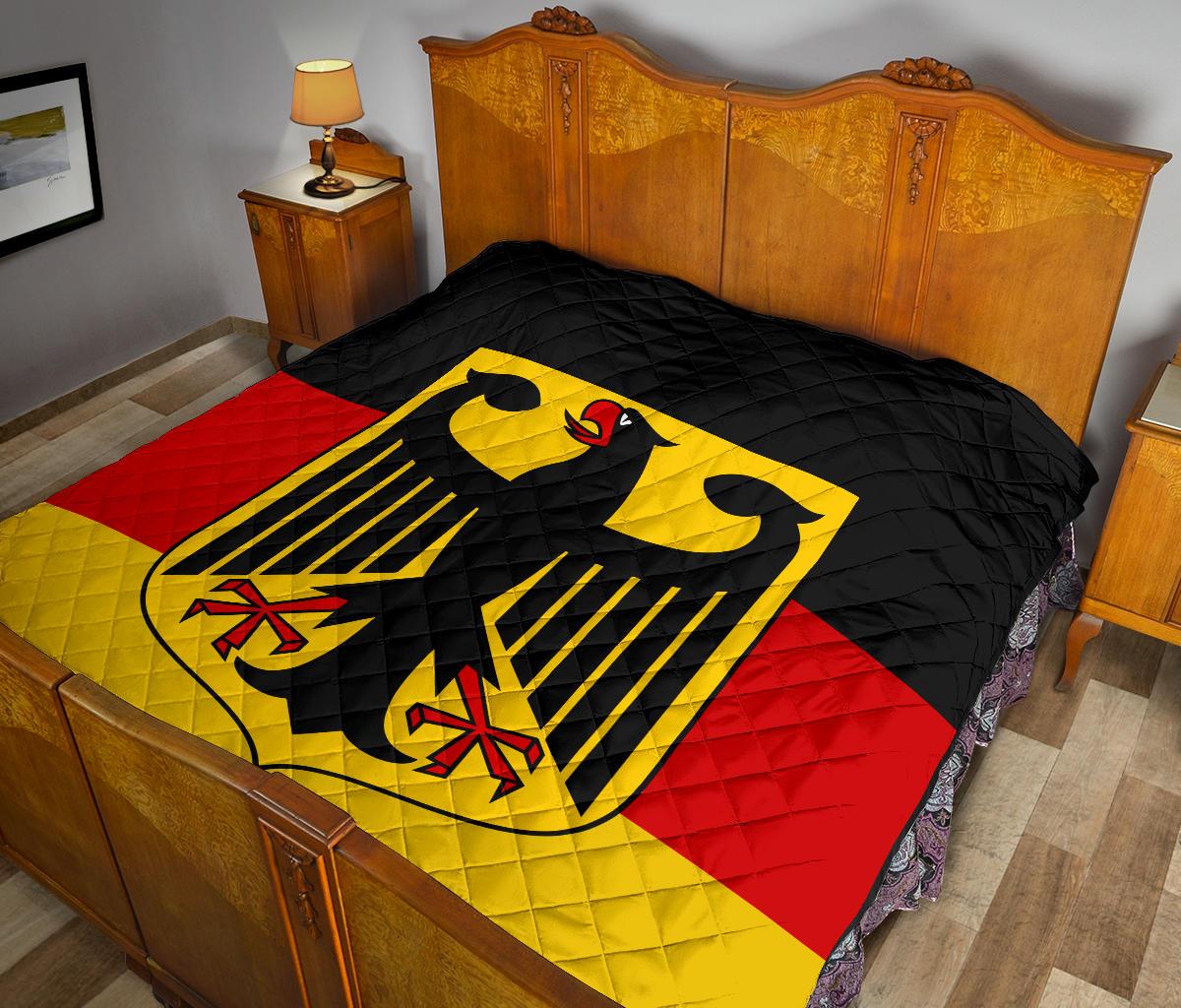 Black quilt with yellow eagle and red-and-yellow German flag accents, quilted stitch pattern