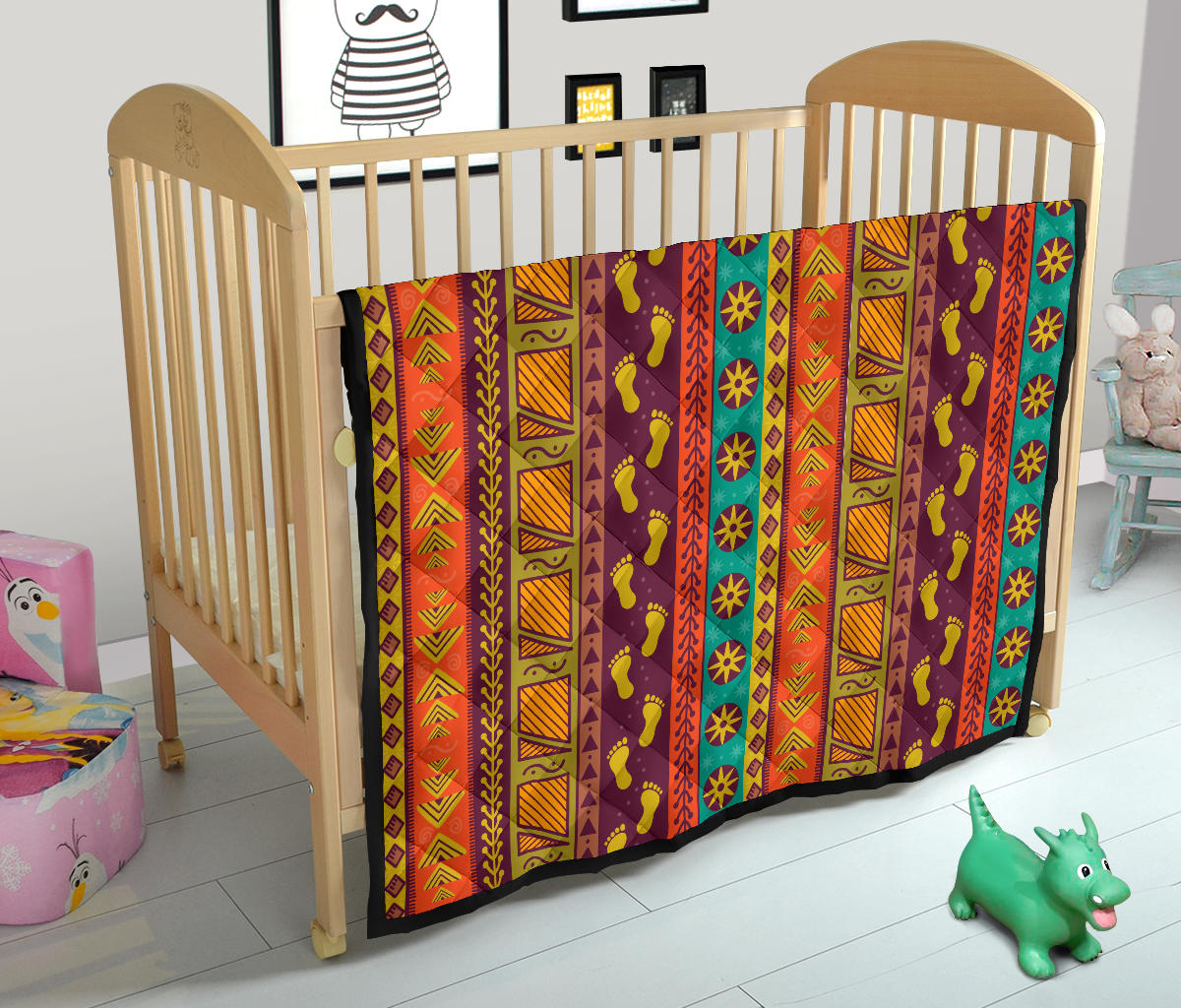 Multicolor Native-style quilt on crib, geometric stripes with foot motif print