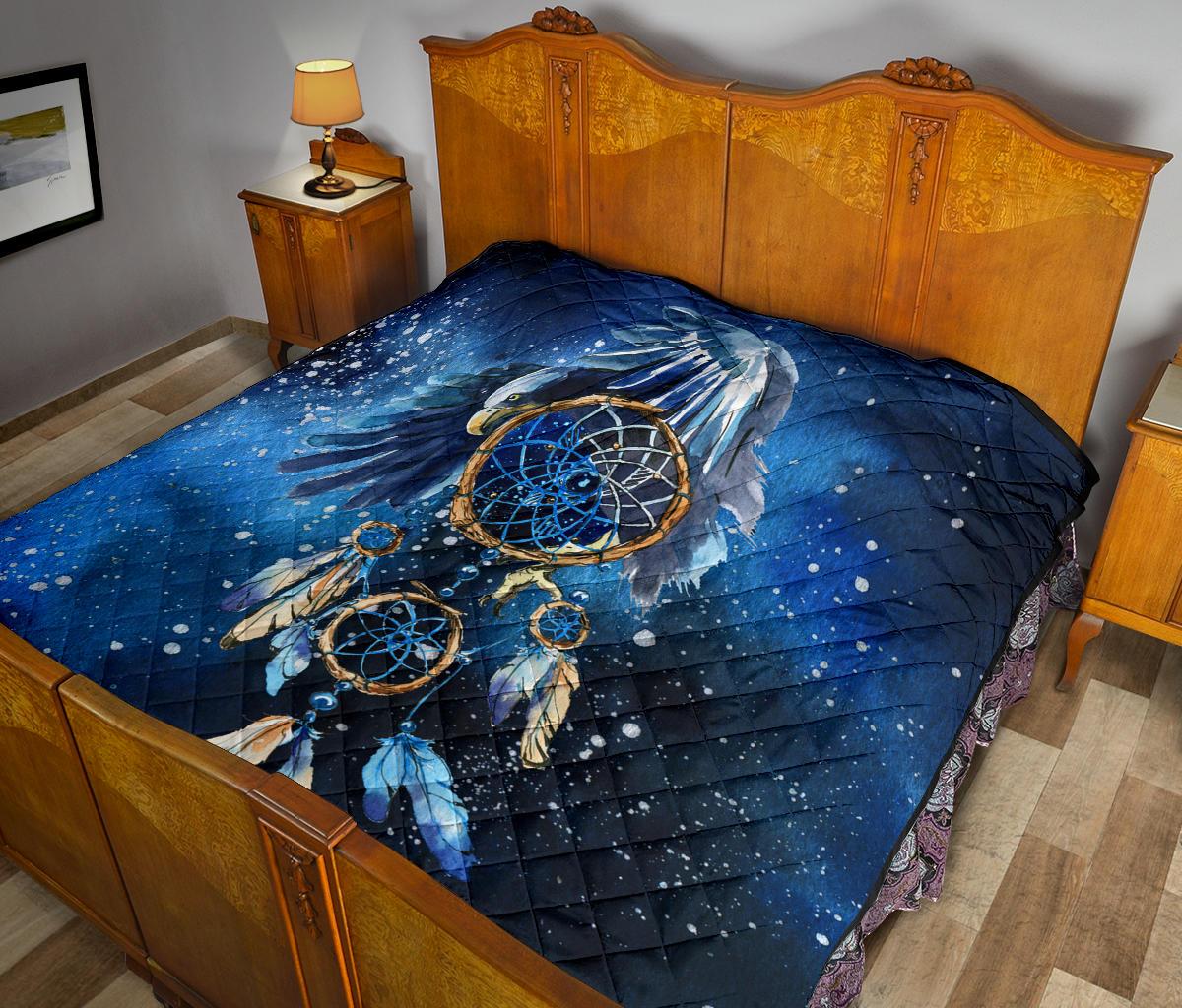 Dreamcatcher quilt, deep blue with gold ring details and white speckle pattern