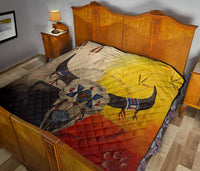 Lightweight multicolor quilt on bed, bison graphic and geometric bands