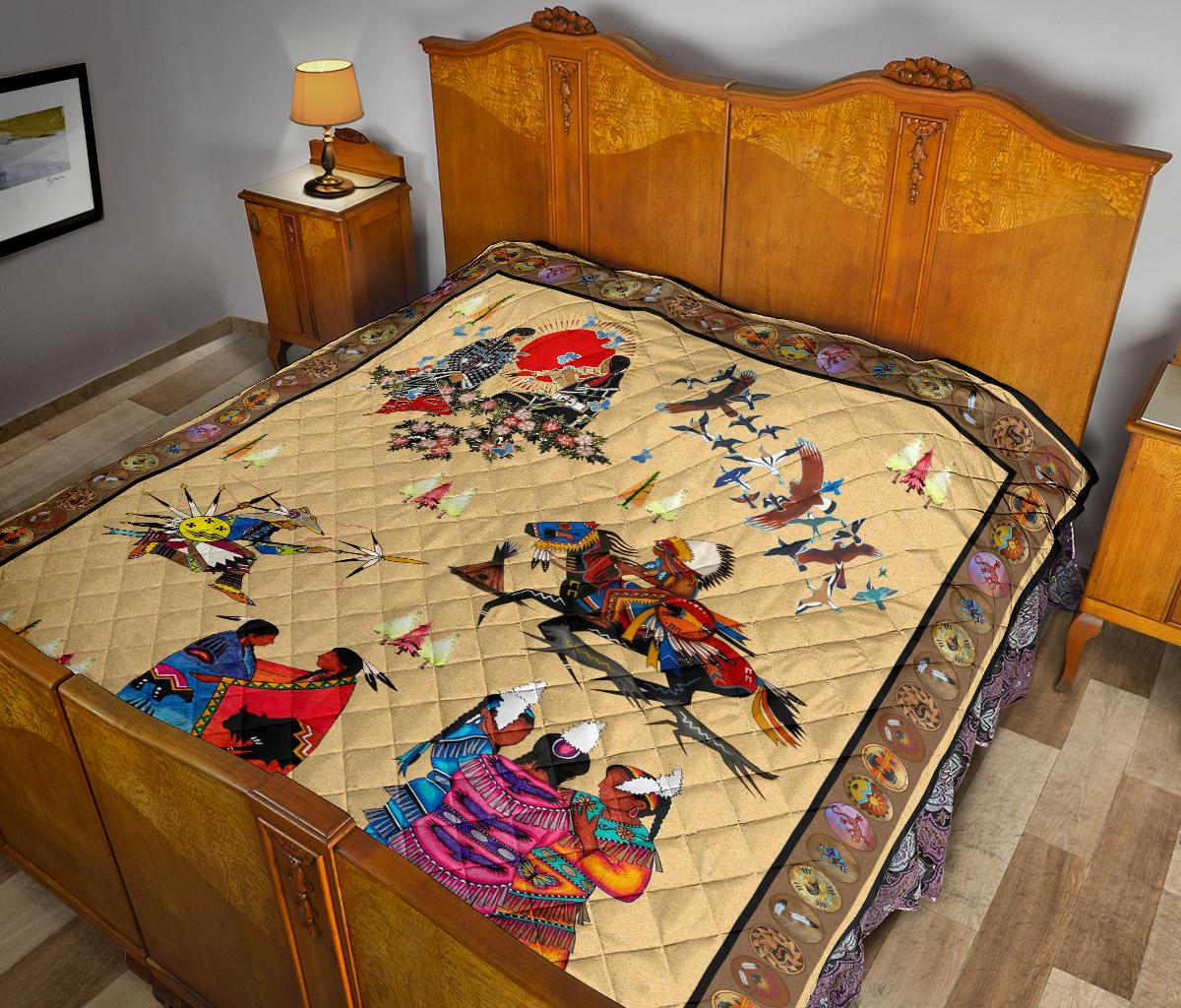 Native American style quilt laid on bed, large rider and warrior motifs