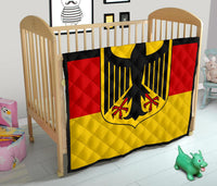 German flag style quilt with red, yellow, and black panels and eagle graphic, baby-bed sized