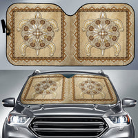 Tan beaded auto sun shade pair with ornate floral totem patterns and gold trim
