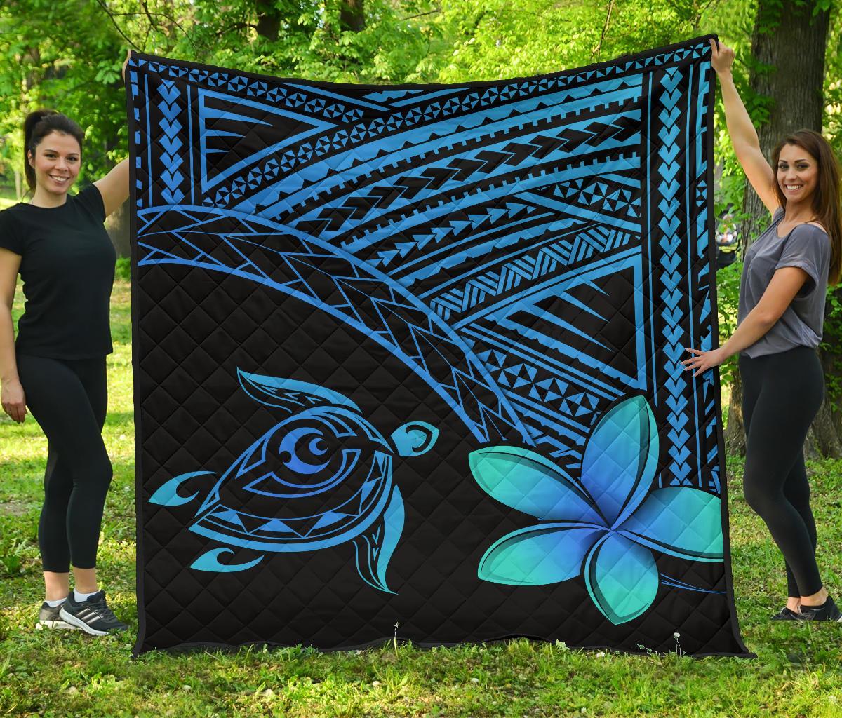 Blue Hawaiian turtle and plumeria quilt with dark geometric border and diamond stitching