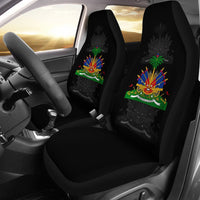 Two black car seat covers with Haiti multicolor emblem on seatbacks