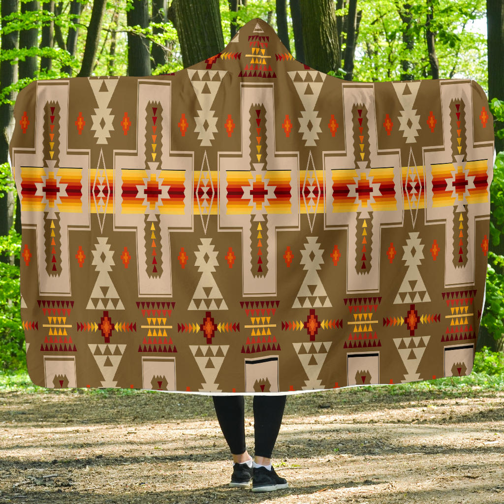 Light brown Native American patterned hooded blanket with multicolor geometric motifs