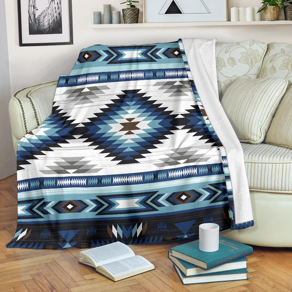 Blue, white and black tribal geometric blanket with zigzag borders and diamond accents