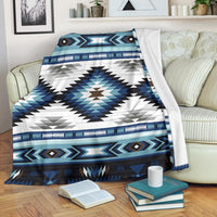 Blue, white and black tribal geometric blanket with zigzag borders and diamond accents
