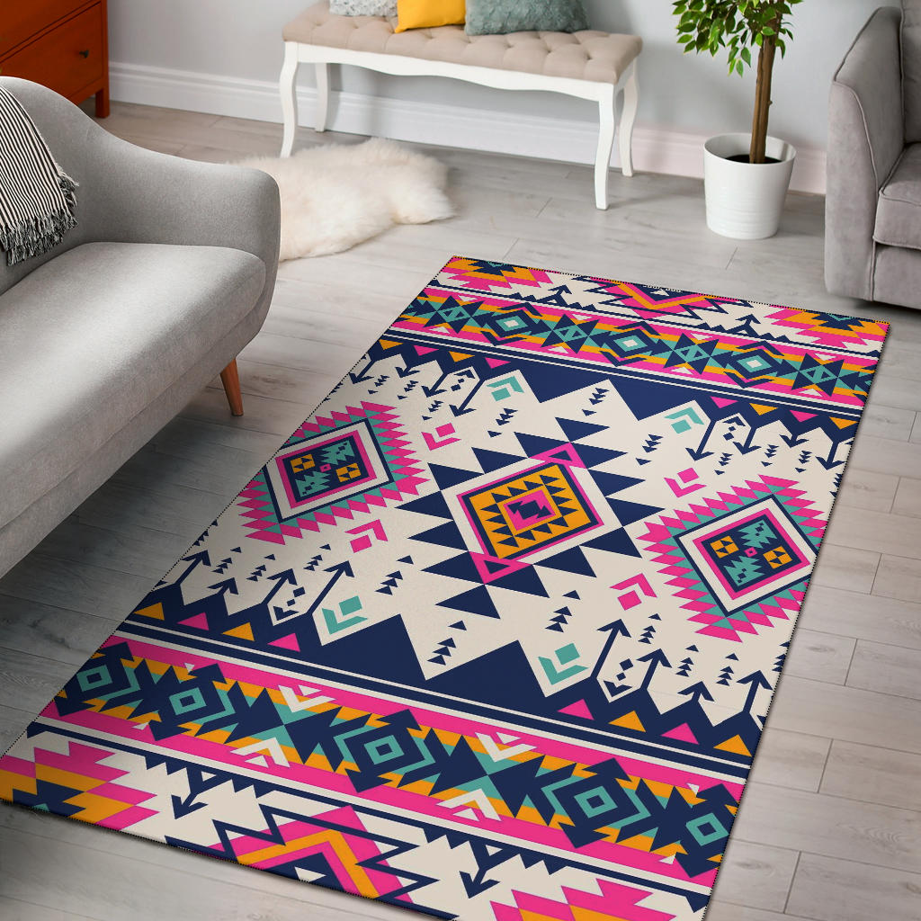 Multicolor Native American geometric area rug with pink, navy, and tribal square motifs.