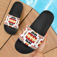 Black slide sandals with white multicolor Native geometric print band across top