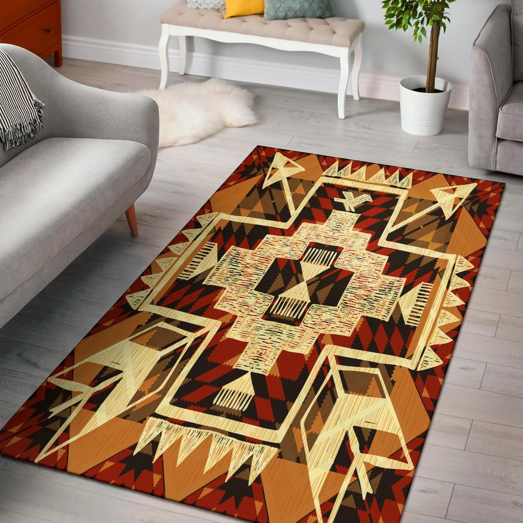 Tribal arrow area rug with orange-brown border and cream, black, red geometric medallion