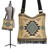 Boho crossbody handbag with native geometric print, fringe trim, and adjustable black strap