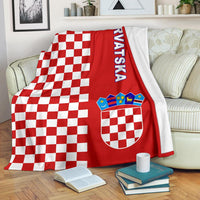 Red checkerboard half-style blanket with “Hrvatska” text and crest graphic