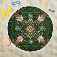 Green round beach blanket with white fringe, mandala Native American bead and cross-feather design