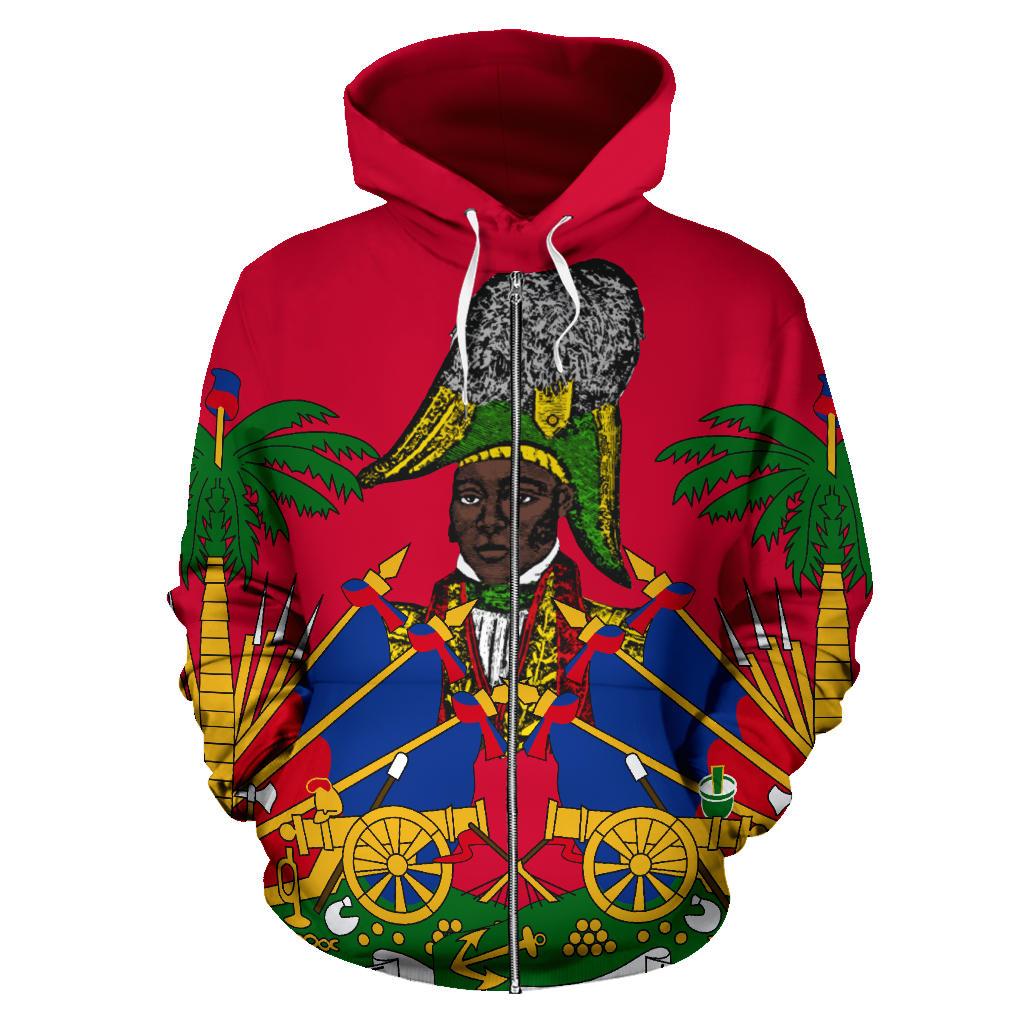 Red zip-up hoodie with colorful Haiti graphic; centered face and weapons on front
