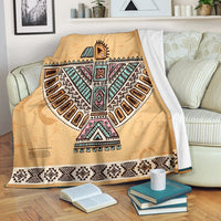Brown Native-style throw blanket with large Thunderbird centerpiece, colorful geometric motifs
