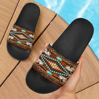 Native-inspired slide sandals with black footbed and multicolor patterned strap