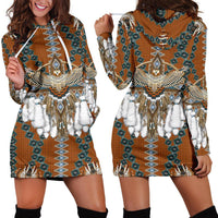 Orange hooded mini dress with teal geometric pattern, bead eagle print, faux fur trim