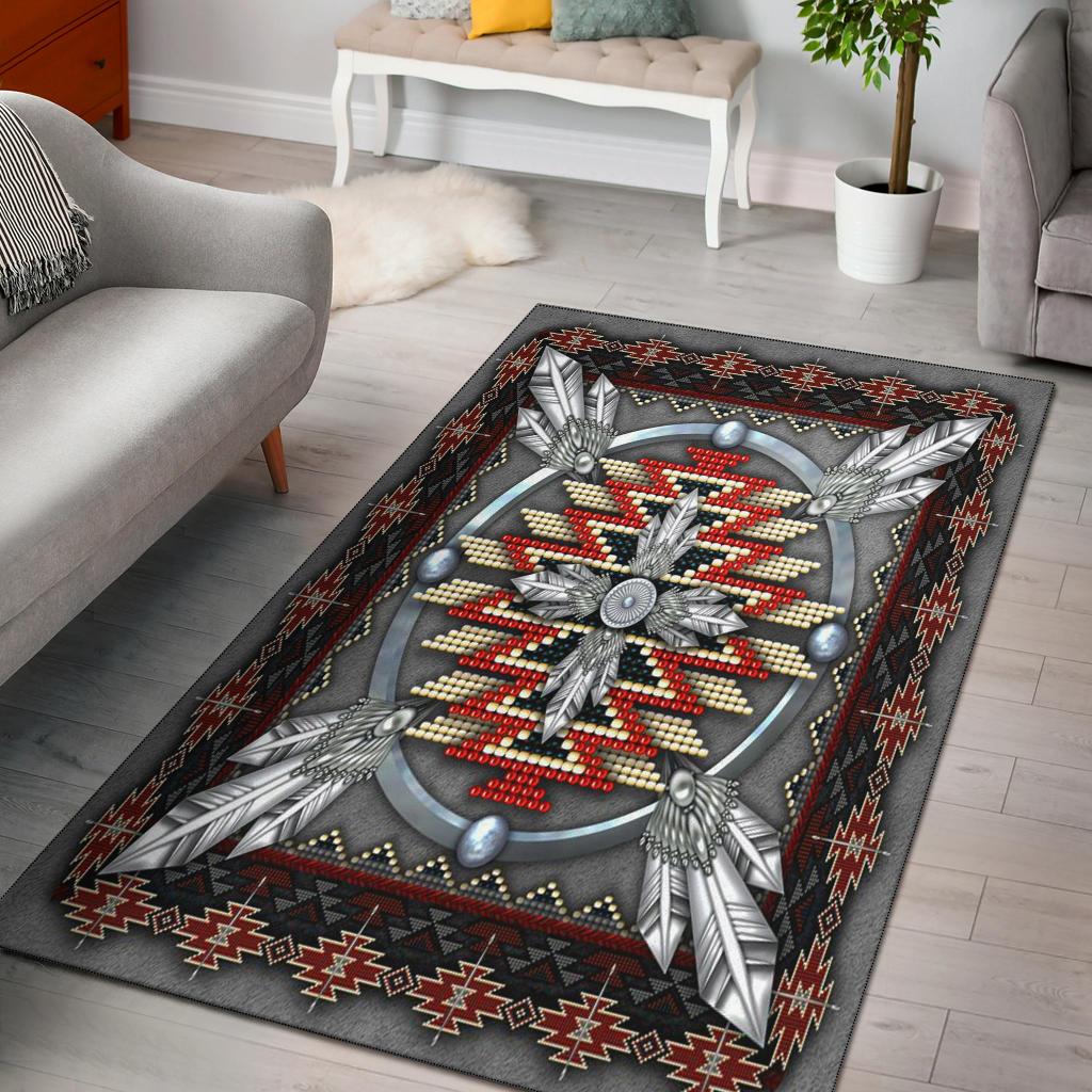 Native American style area rug with dark gray background and multicolor medallion, feathers border
