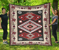 Premium quilt with red, gray, black, and cream geometric star and diamond pattern.