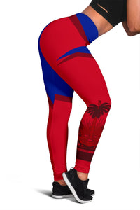 Red & blue Haiti leggings, side view with palm/crest print near ankle