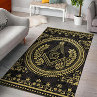 Black area rug with gold Freemason-style medallion and ornate border pattern