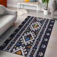 Dark navy area rug with geometric white squares and colorful diamond medallions
