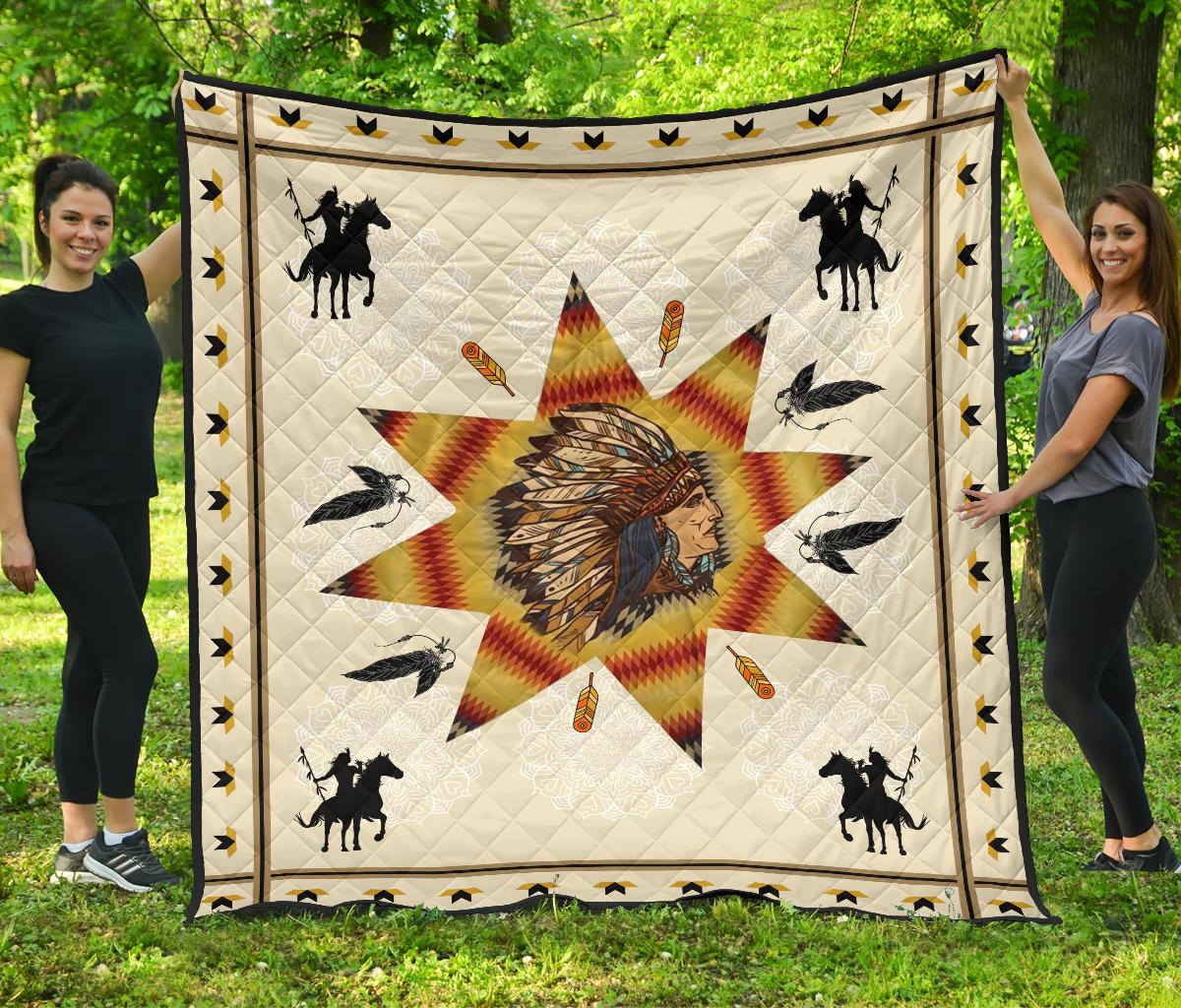 White Native American chief quilt with starburst center, horses, birds, and gold arrow border