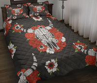 Black quilt bed set with bison center, red/white flowers; includes two matching pillows