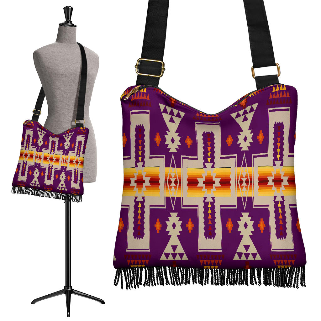 Purple crossbody bag with Native-inspired geometric pattern, fringe hem, adjustable strap.