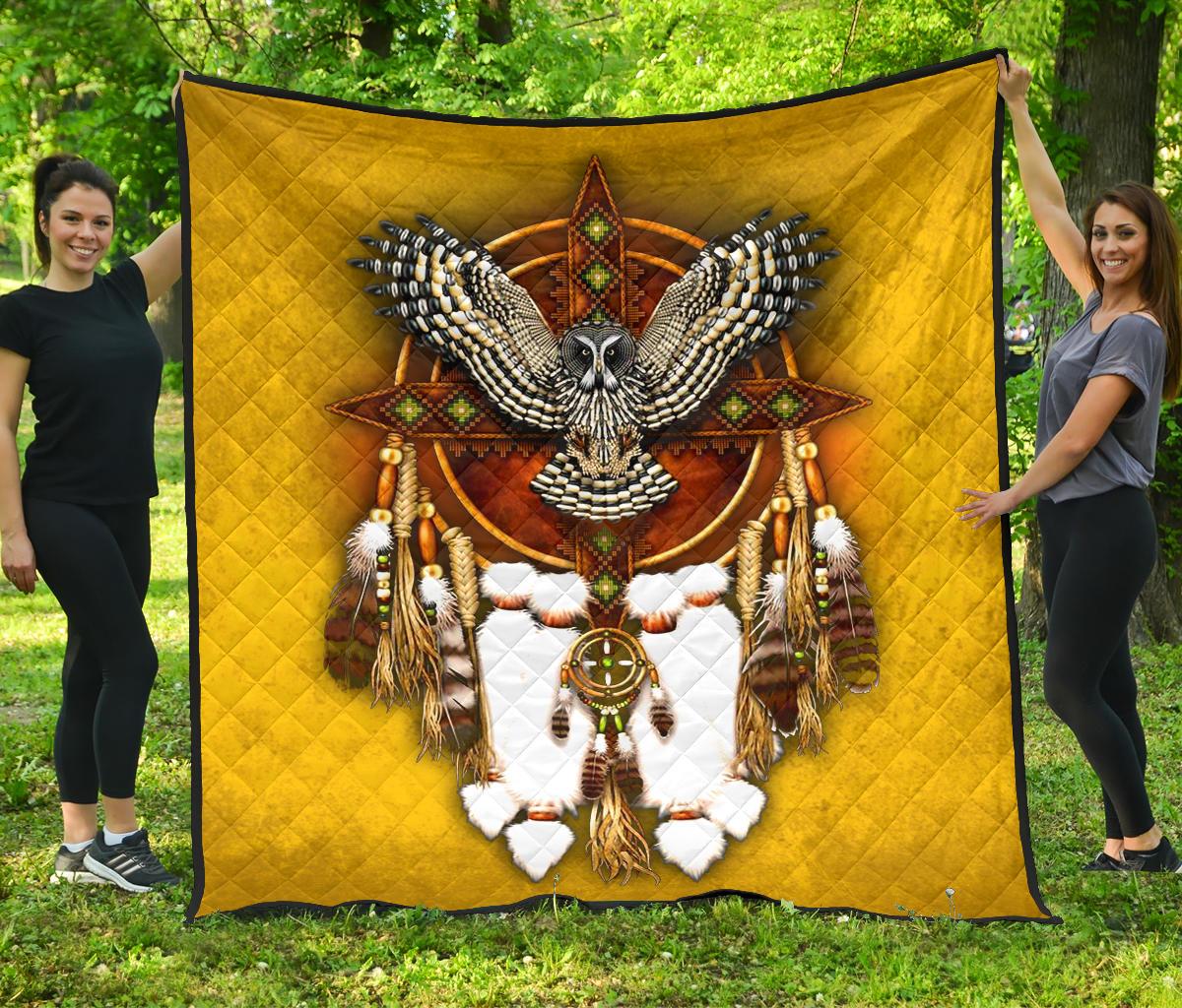 Yellow quilt with owl and dreamcatcher applique in multicolor, diamond stitching, black border