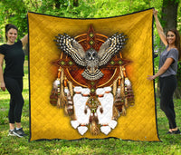 Yellow quilt with owl and dreamcatcher applique in multicolor, diamond stitching, black border