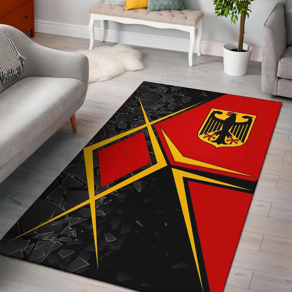 Germany area rug with red and black geometric design, yellow emblem and border lines