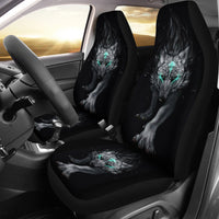 Set of car seat covers with dark wolf artwork, teal glowing eyes on black fabric